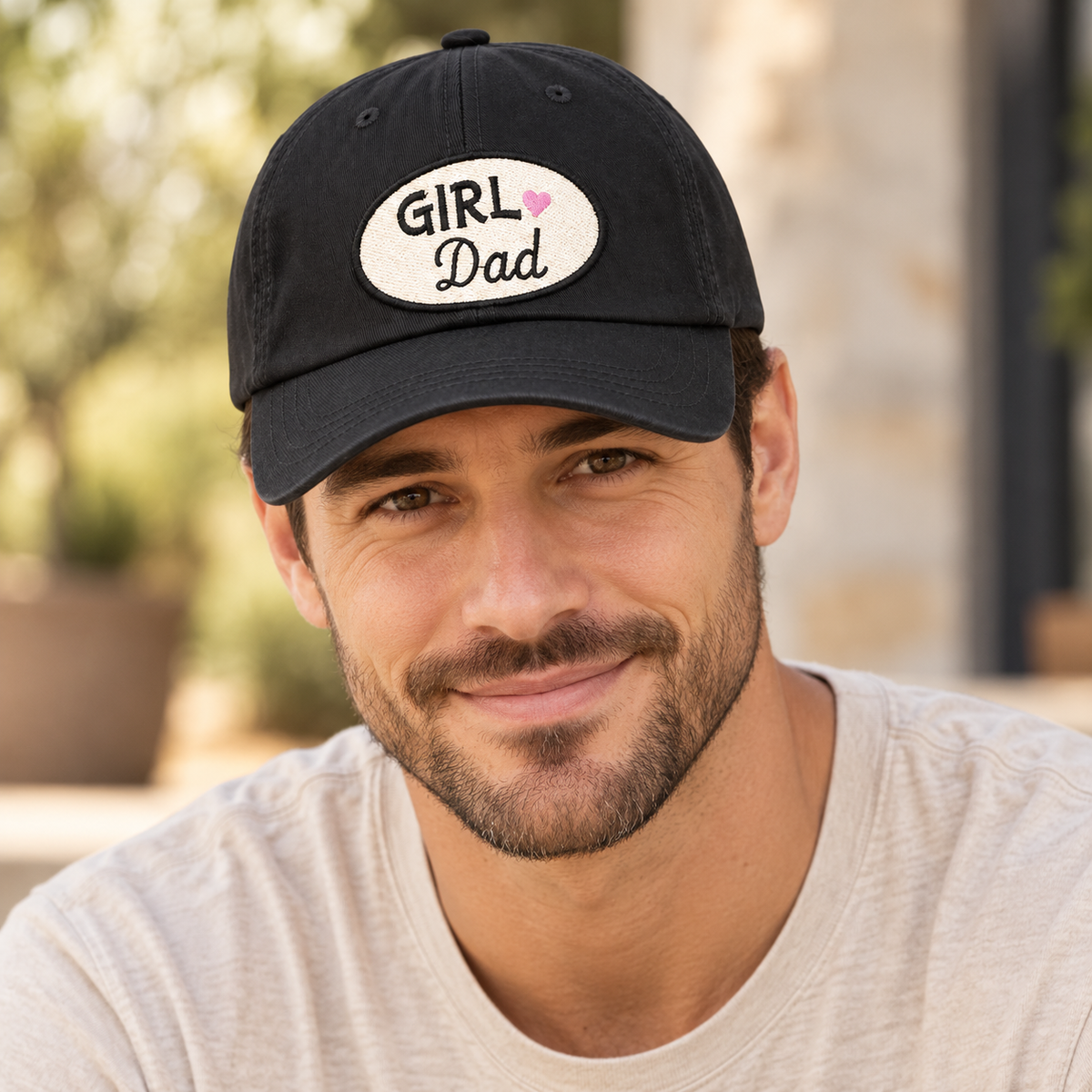 Male model wearing a black Girl Dad embroidered patch hat